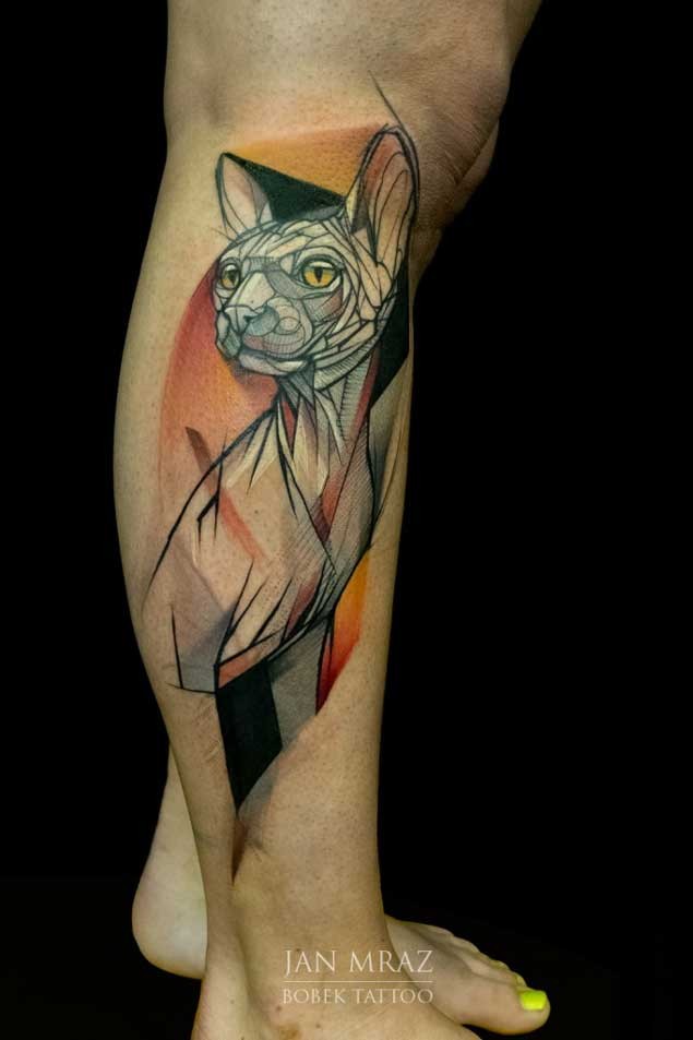 3D style painted cartoon like abstract Sphinx cat tattoo on leg muscle