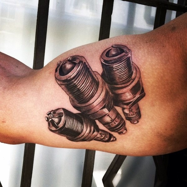 3D style various type of spark plugs tattoo on biceps