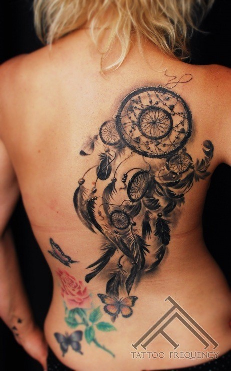 3D style very detailed back tattoo of dream catcher and feather