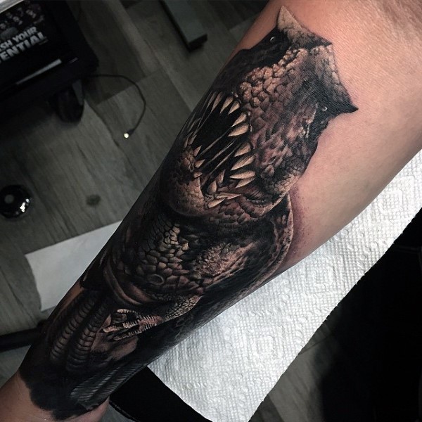 3D style very detailed colorful forearm tattoo of creepy dinosaur