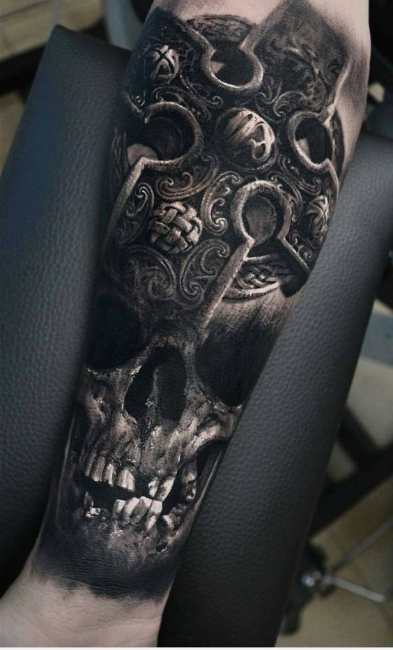 3D style very detailed forearm tattoo of old human skull with ancient cross