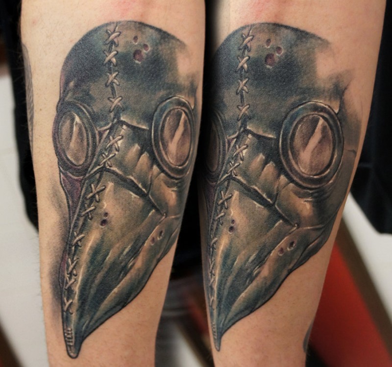 3D very detailed arm tattoo of creepy plague doctors mask