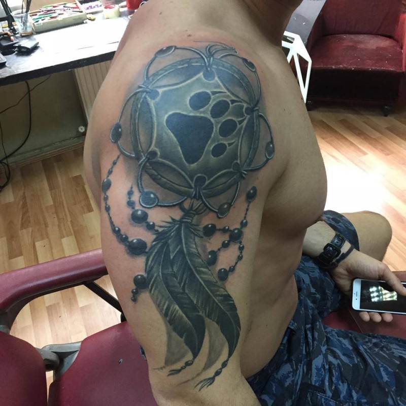 3D very realistic looking colored dream catcher tattoo on shoulder stylized with animal paw