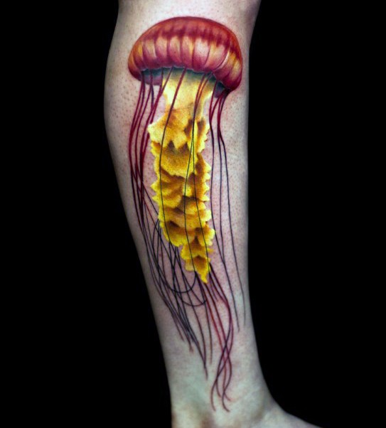 3D very realistic looking multicolored jelly-fish tattoo on leg
