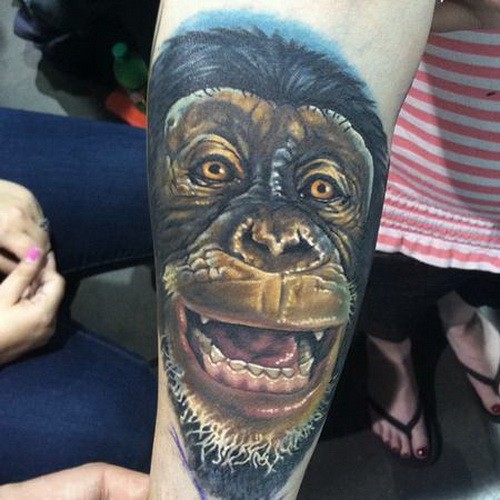 Amazing color-ink chimpanzee head tattoo on arm