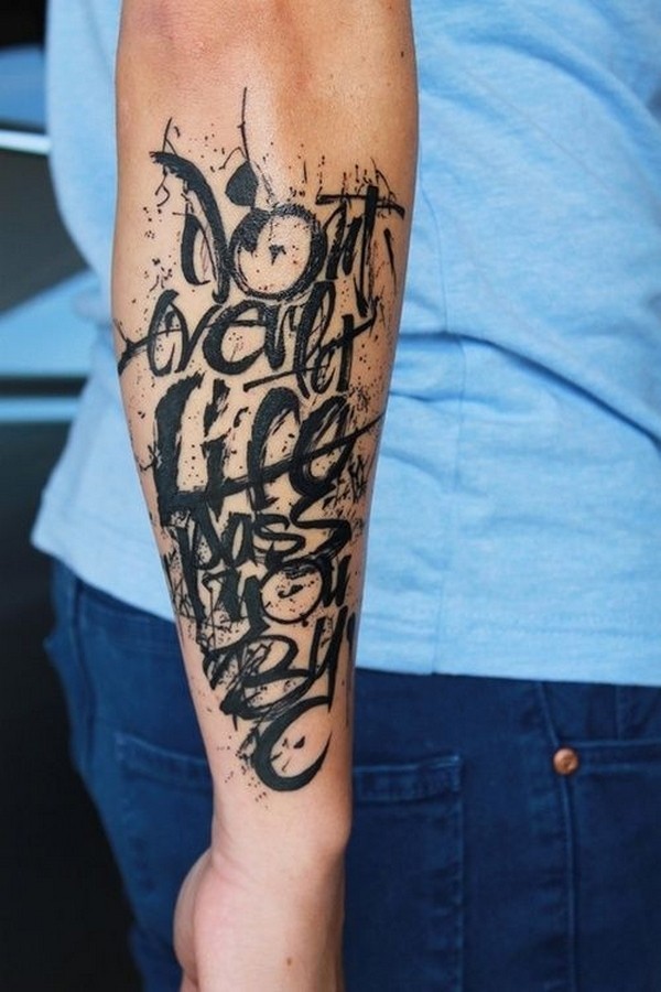 Amazing disorder-lettered black-ink quote tattoo for men on forearm