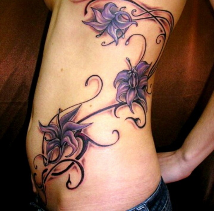 Amazing large violet exotic flowers tattoo on side