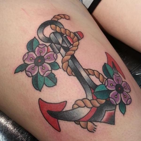 Amazing old school anchor with flowers tattoo on thigh