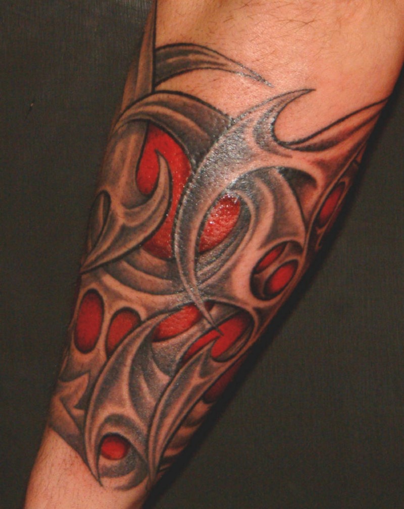 Amazing red-and-black tribal tattoo sleeve for men on forearm