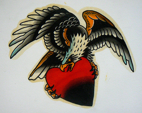 American old school eagle protecting his red heart tattoo design