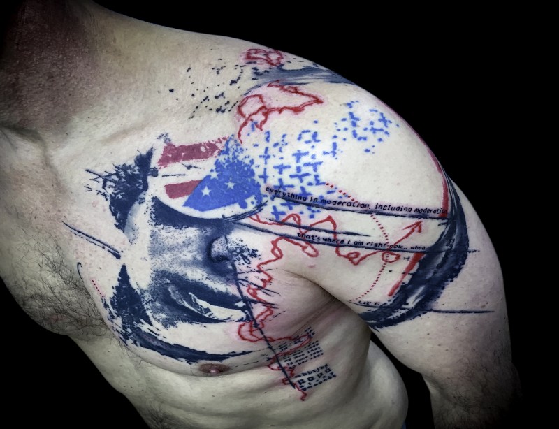 American traditional style colored shoulder tattoo of flag with lettering