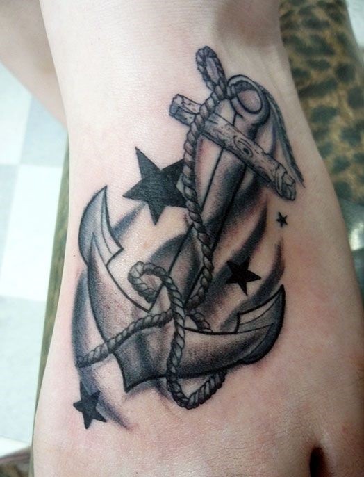 Anchor and stars traditional tattoo on foot