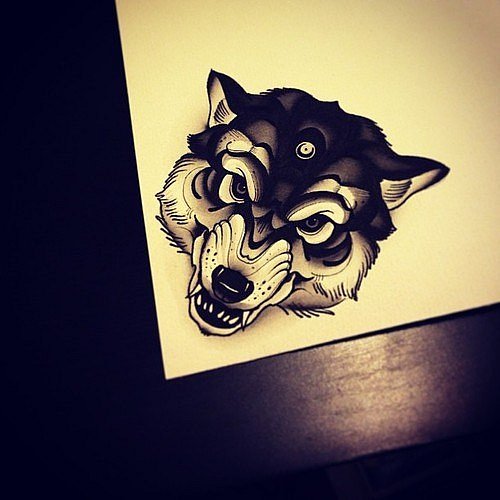 Angry black wolf with a sign on a forehead tattoo design