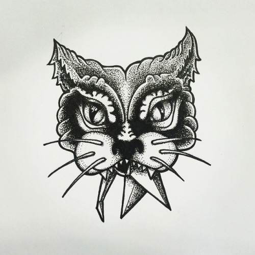 Angry dorwork cat head chewing arrow tips tattoo design