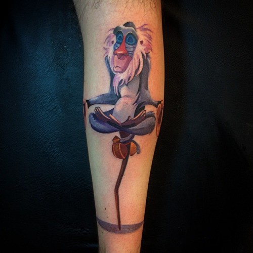 Animated colorful baboon tattoo on arm