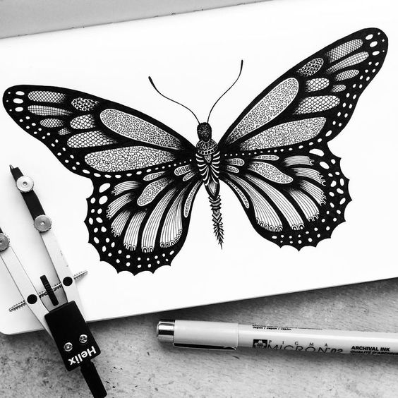 Attractive geometric-ornamented butterfly tattoo design