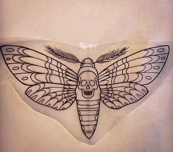 Attractive uncolored skull-printed moth tattoo design