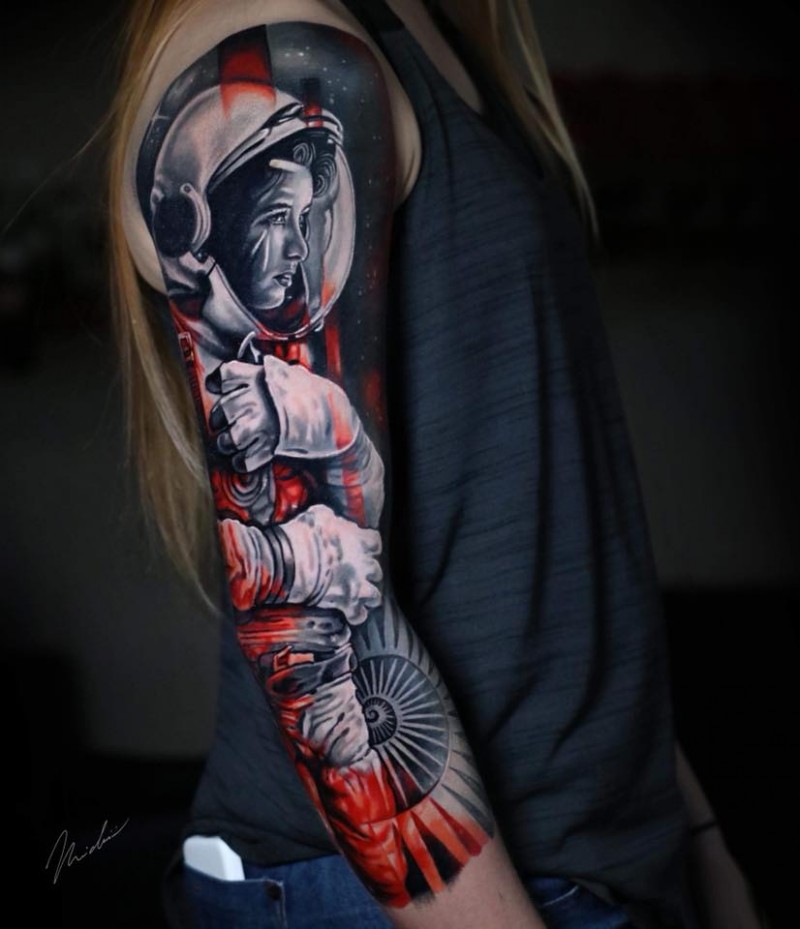 Awesome astronaut woman tattoo on arm