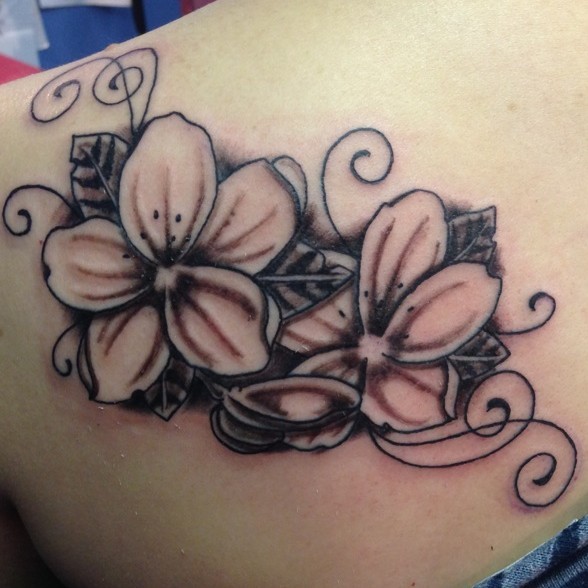 Awesome black-ink jasmine flowers with curls tattoo