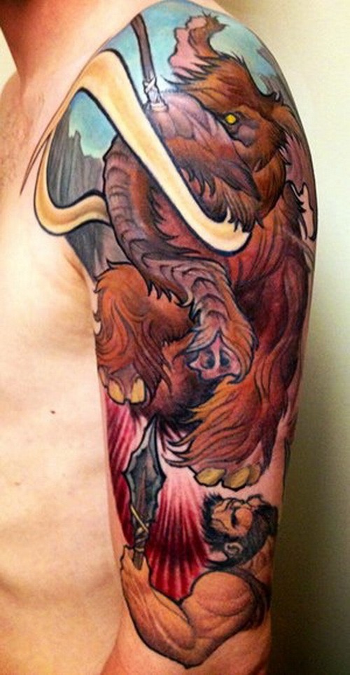 Awesome color-ink fighting mammoth tattoo on upper arm