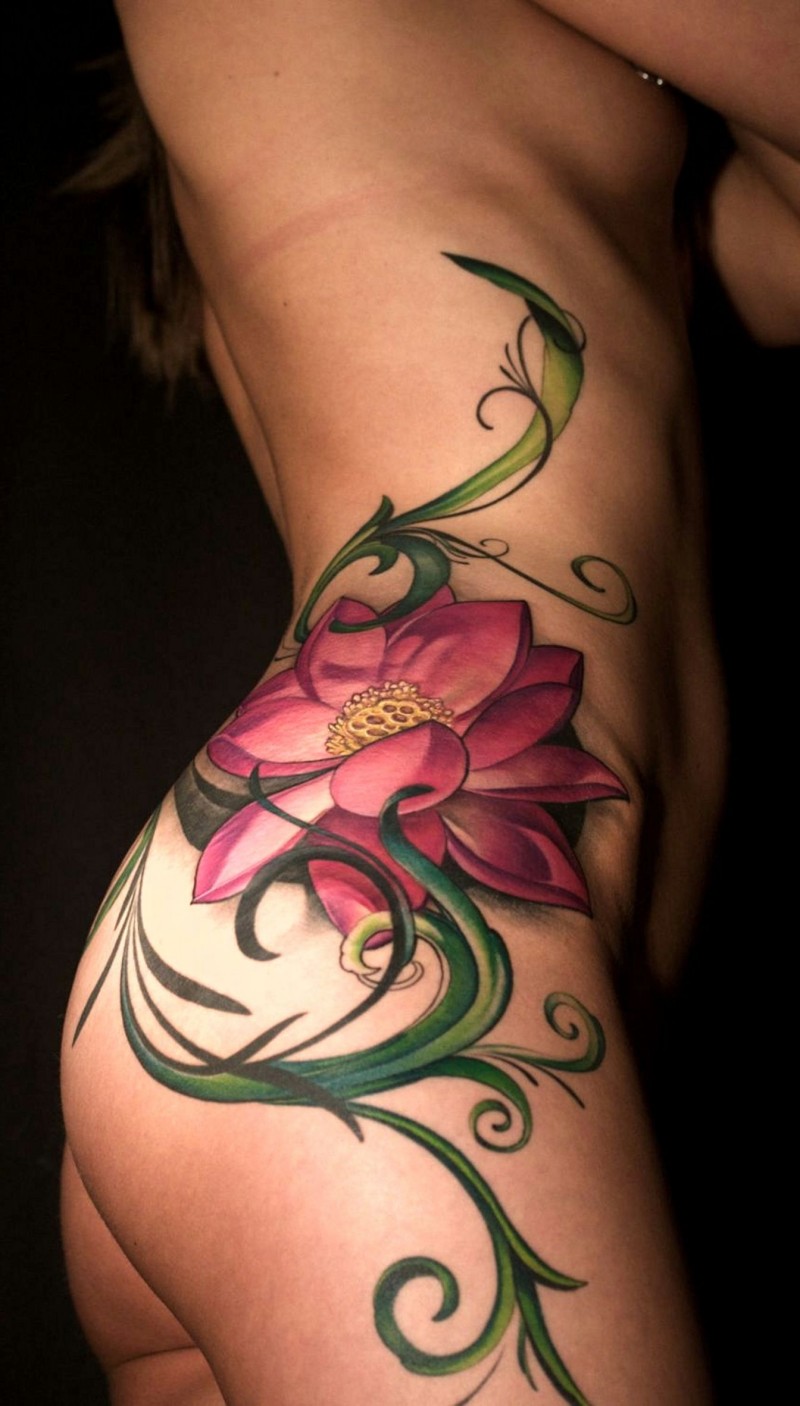 Awesome colorful exotic flower tattoo on side