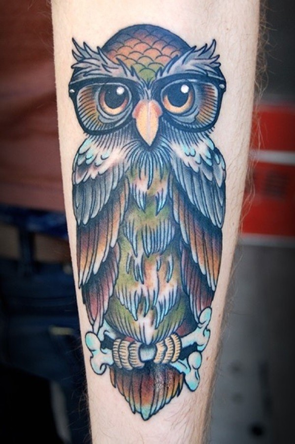 Awesome colorful owl in glassess tattoo for guys on forearm