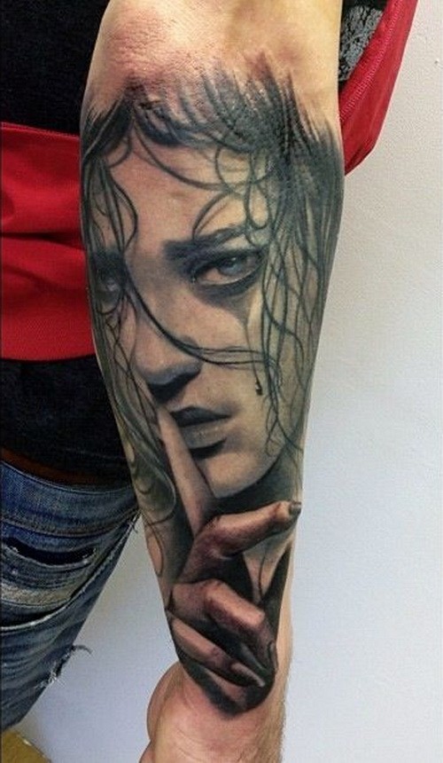 Awesome crying girl face tattoo on outer forearm