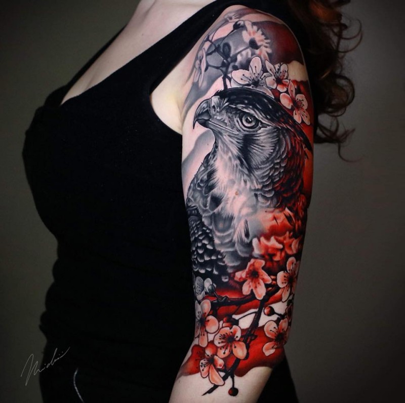 Awesome falcon and flowers tattoo for woman