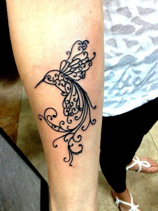 Awesome girly curled black-ink bird tattoo on forearm