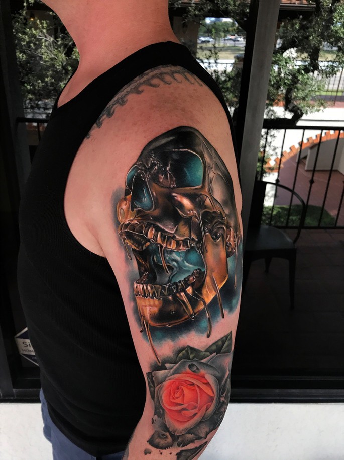 Awesome metal skull tattoo on shoulder