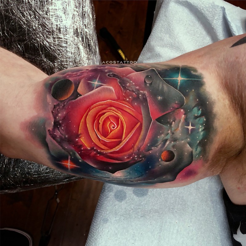 Awesome realistic rose in space tattoo on biceps