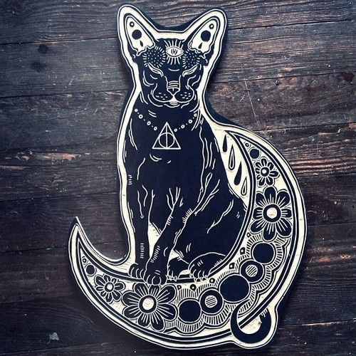 Awesome sphynx cat sitting on patterned moon tattoo design