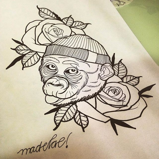 Awesome uncolored monkey in hat with roses tattoo design