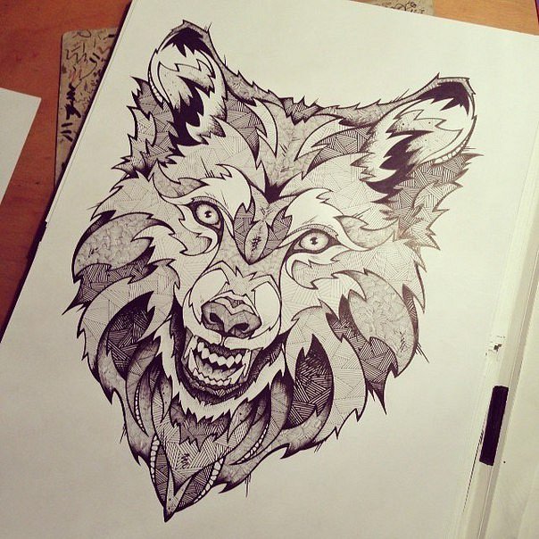 Awesome wolf head with geometric pattern tattoo design