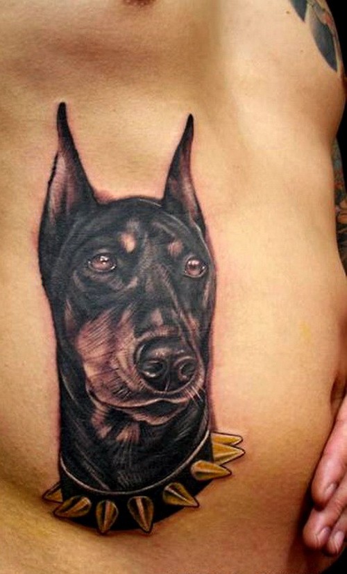 Beautiful black-and-white doberman in thorned dog-collar tatto on side