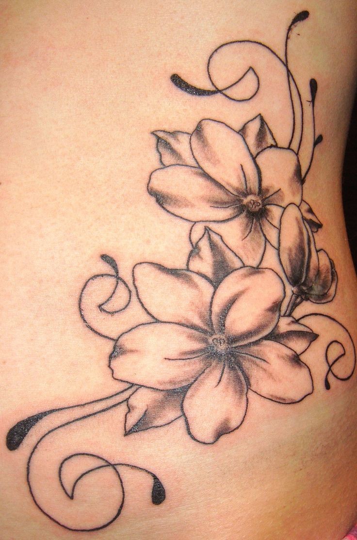 Beautiful black-contour dogwood flower tattoo
