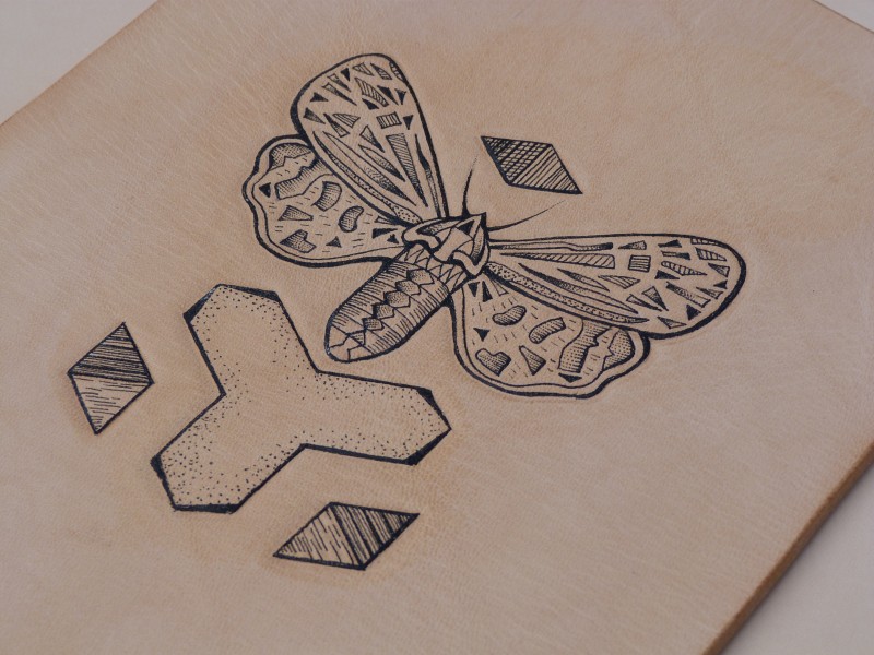 Beautiful grey-ink moth and geometric figures tattoo design
