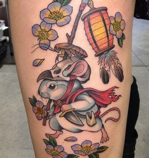 Beautiful japanese colorful rodent with flowers and lamp tattoo on thigh