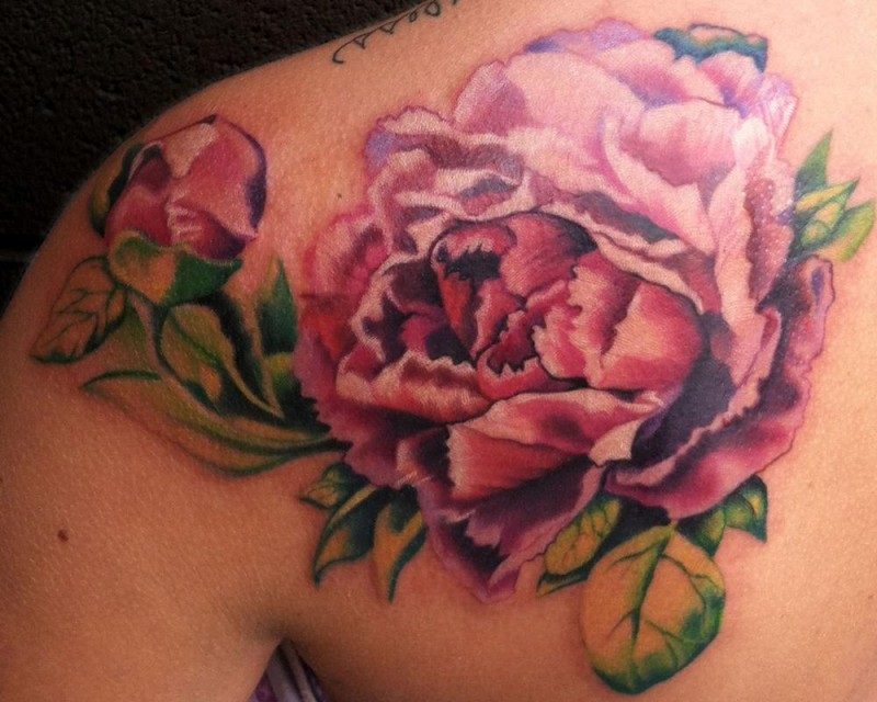 Beautiful rosy peony flower tattoo on back