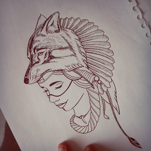 Beautiful young indian woman in wolf feathered hat tattoo design