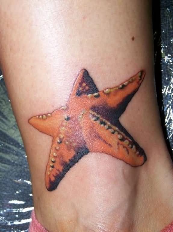 Big amazing orange starfish tattoo on ankle