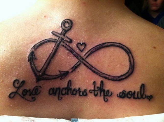 Black-and-white anchor infinity with love anchors the soul lettering tattooon back