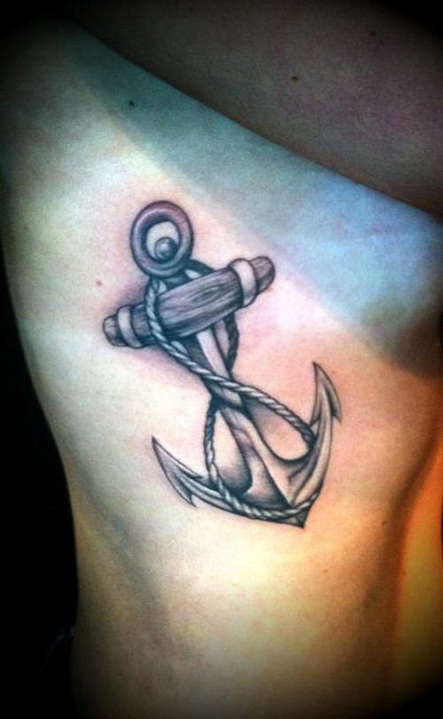 Black-and-white anchor infinity with rope tattoo on rib-side