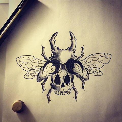 Black-and-white bug with toothless body tattoo design