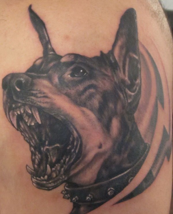 Black-and-white doberman with grin tattoo