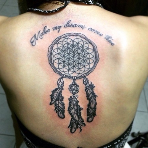 Black-and-white flower of life in dream catcher with quote tattoo on back