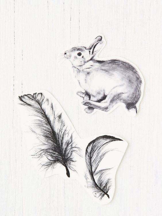 Black-and-white jumping hare and big falling feathers tattoo design