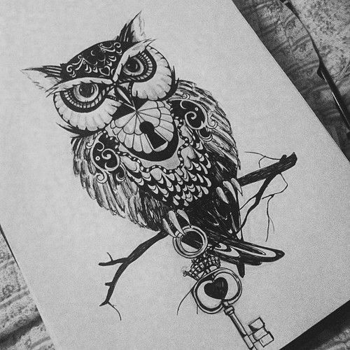 Black-and-white owl with key hole on breast tattoo design