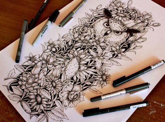 Black-and-white owl with strich look among flowers tattoo design