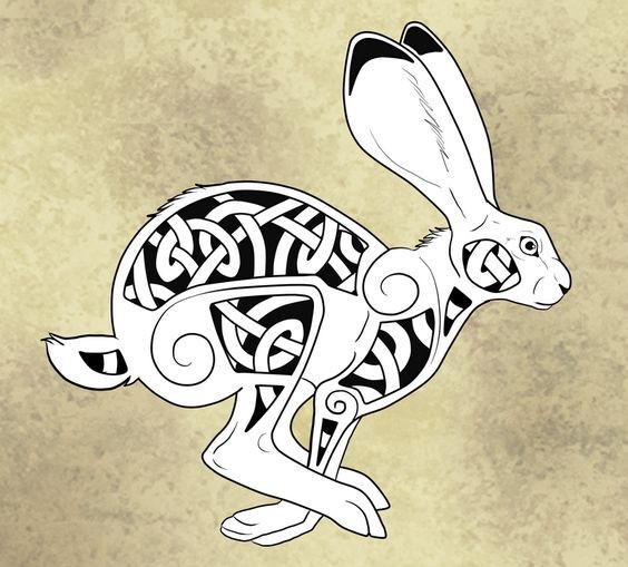 Black-and-white running hare with celtic pattern tattoo design